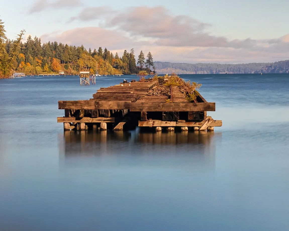 Tranquil scene of an old pier on a calm day at Ruston Way Waterfront, Olympia, Washington.