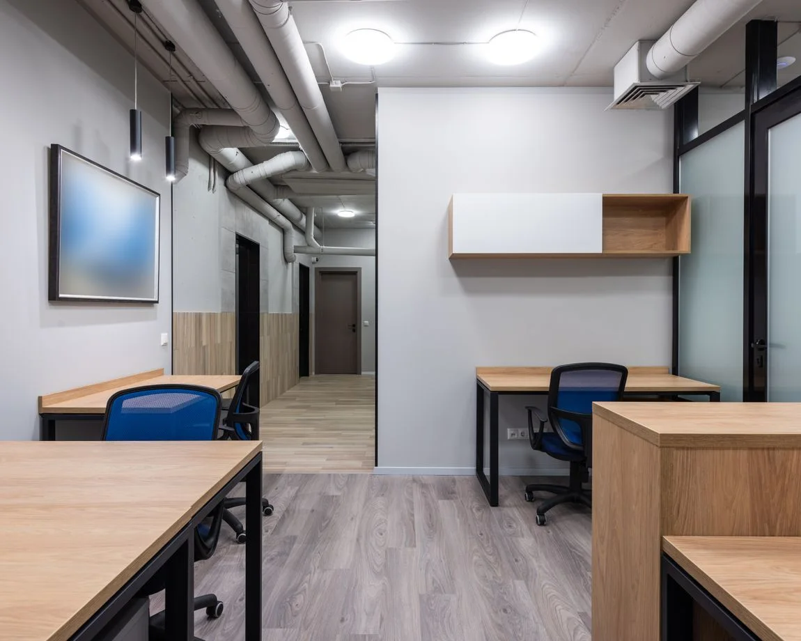 Contemporary office interior with minimalist design and wooden furniture.